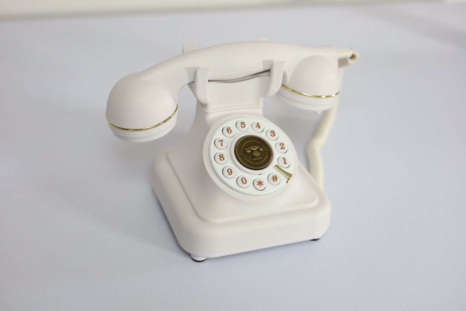 An ivory vintage-style telephone used for the wedding audio guestbook