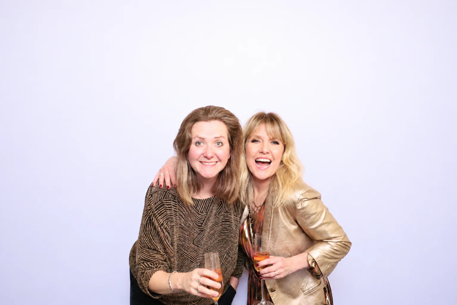 Two guests enjoying a corporate photo booth experience in London